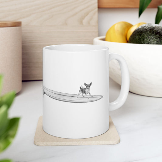 White mug with a design of a chihuahua on a longboard on a white background.