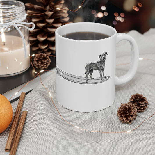 White mug with a graphic of a Great Dane on a surfboard on a white background