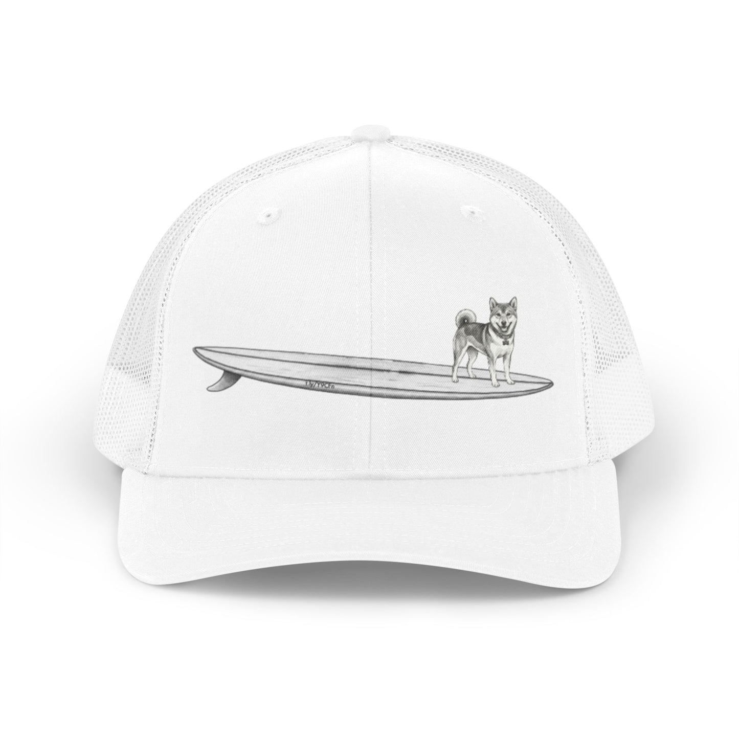 White mesh trucker hat with a graphic of a Shiba Inu dog hanging twenty on a long  surfboard design on a white background