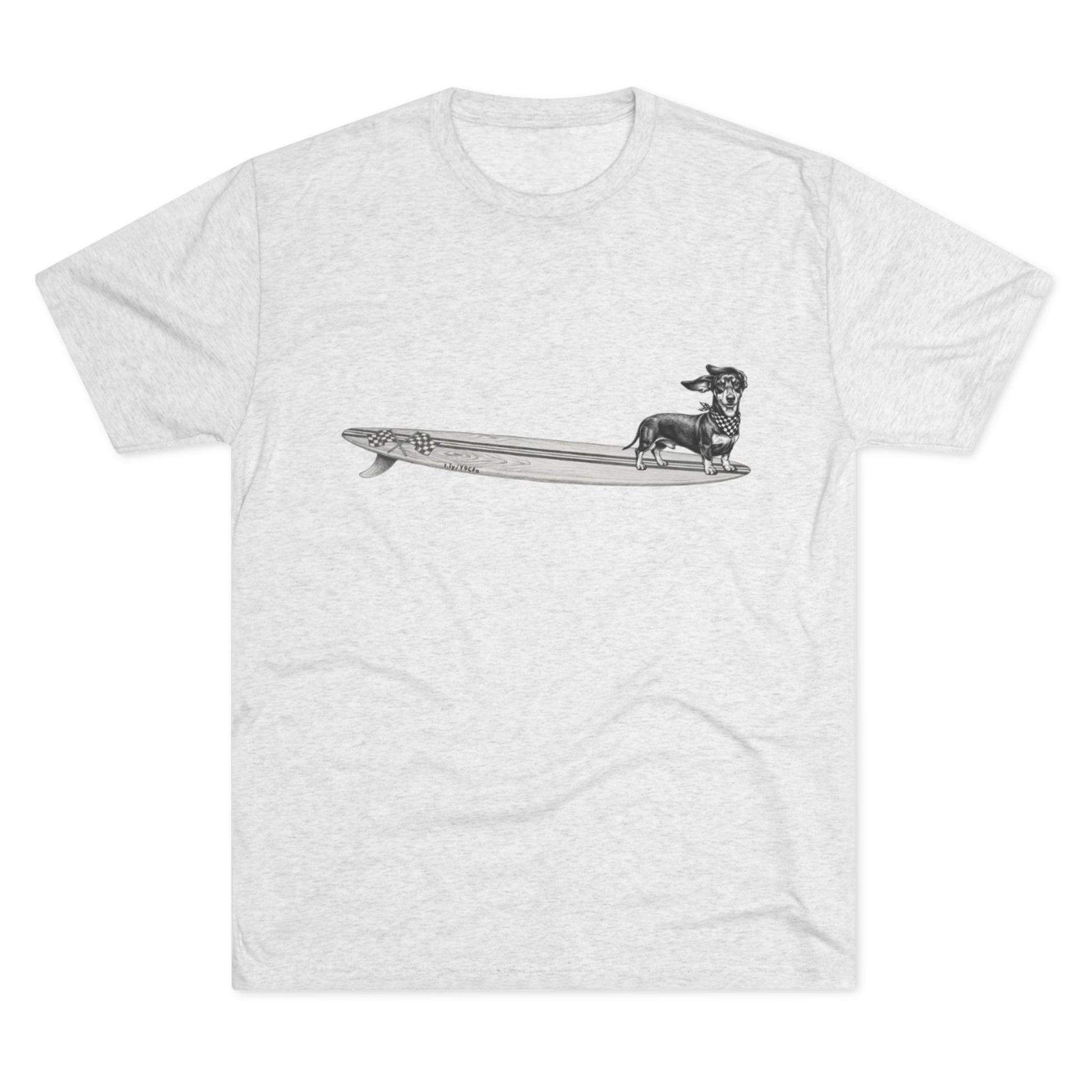 White tshirt with a Dachshund dog on a longboard surfboard with racing flags on it. The dog has a checkered bandana around it's neck. 