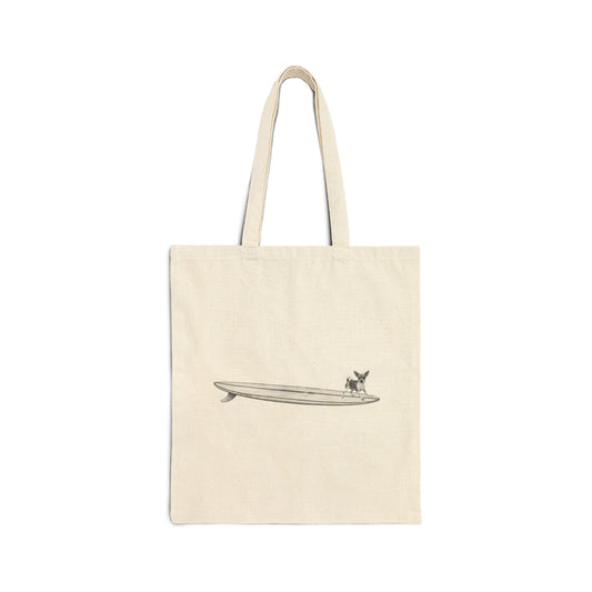 Beige tote bag with a graphic of a chihuahua on a surfboard on a white background