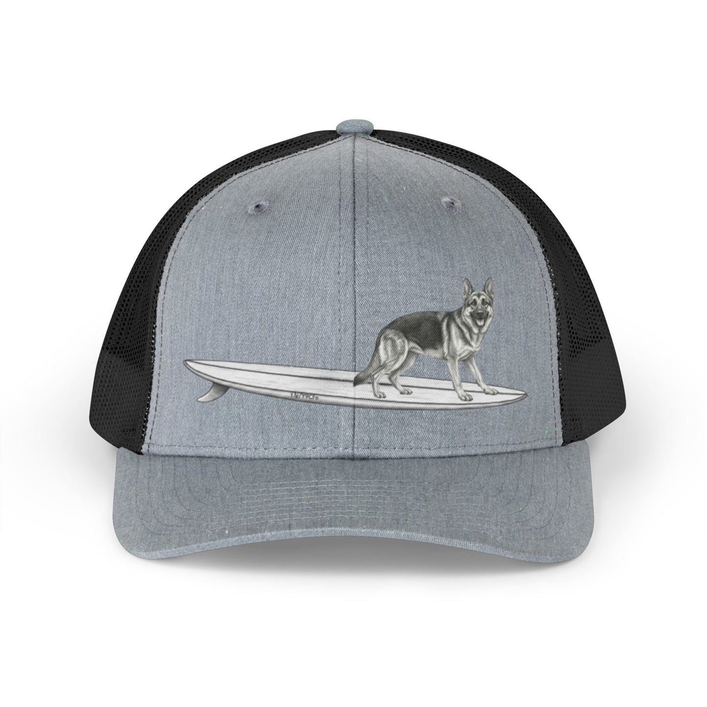 Gray and black mesh trucker hat with a graphic of a German Shepherd dog hanging twenty on a long surfboard on a gray background.