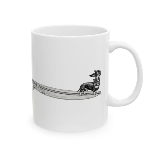 White mug with a black and white illustration of a white mug with a dachshund with a checkered scarf hanging twenty on a surfboard graphic with checkered racing flags on a white background 