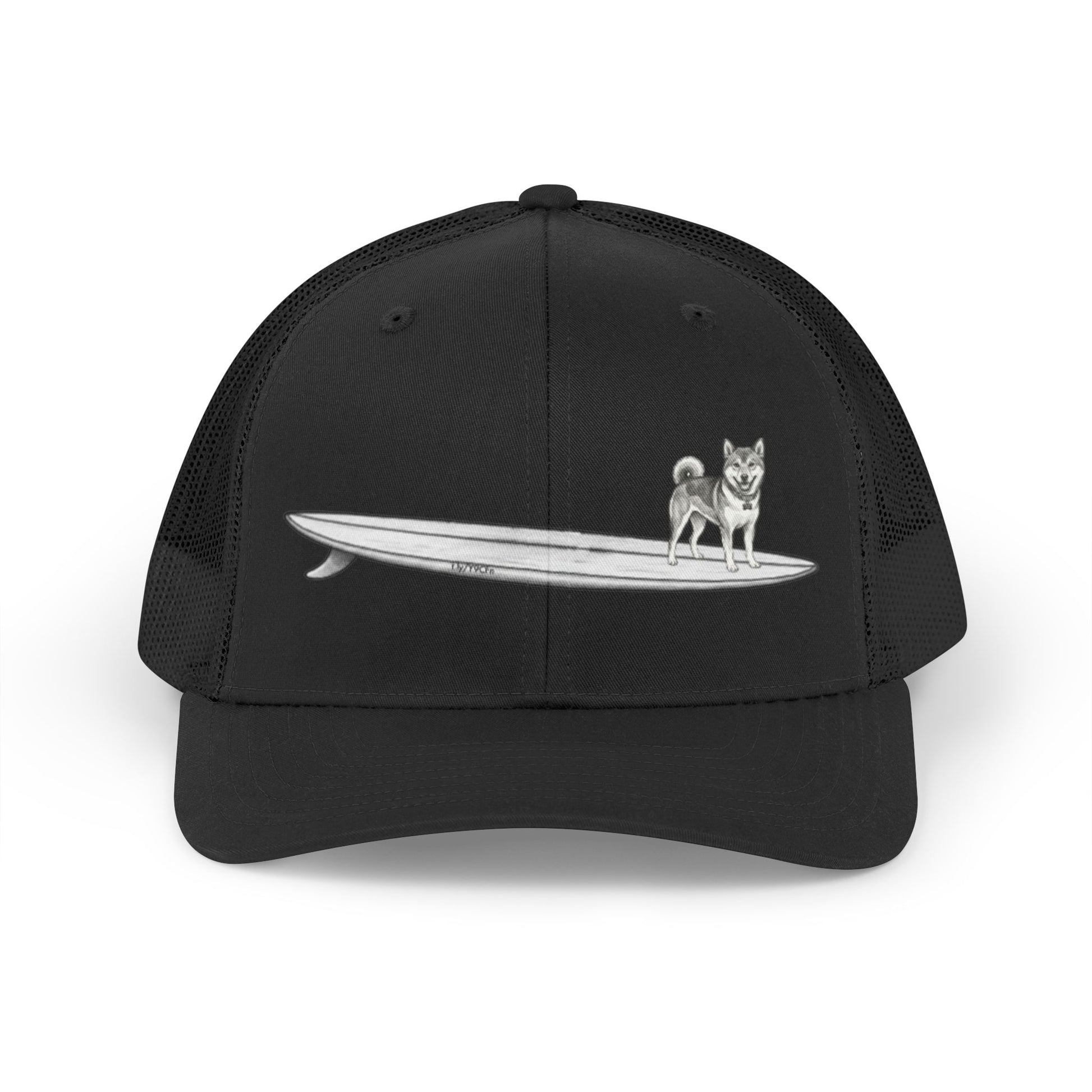 Black mesh trucker hat with a graphic of a Shiba Inu dog hanging twenty on a long  surfboard design on a black background