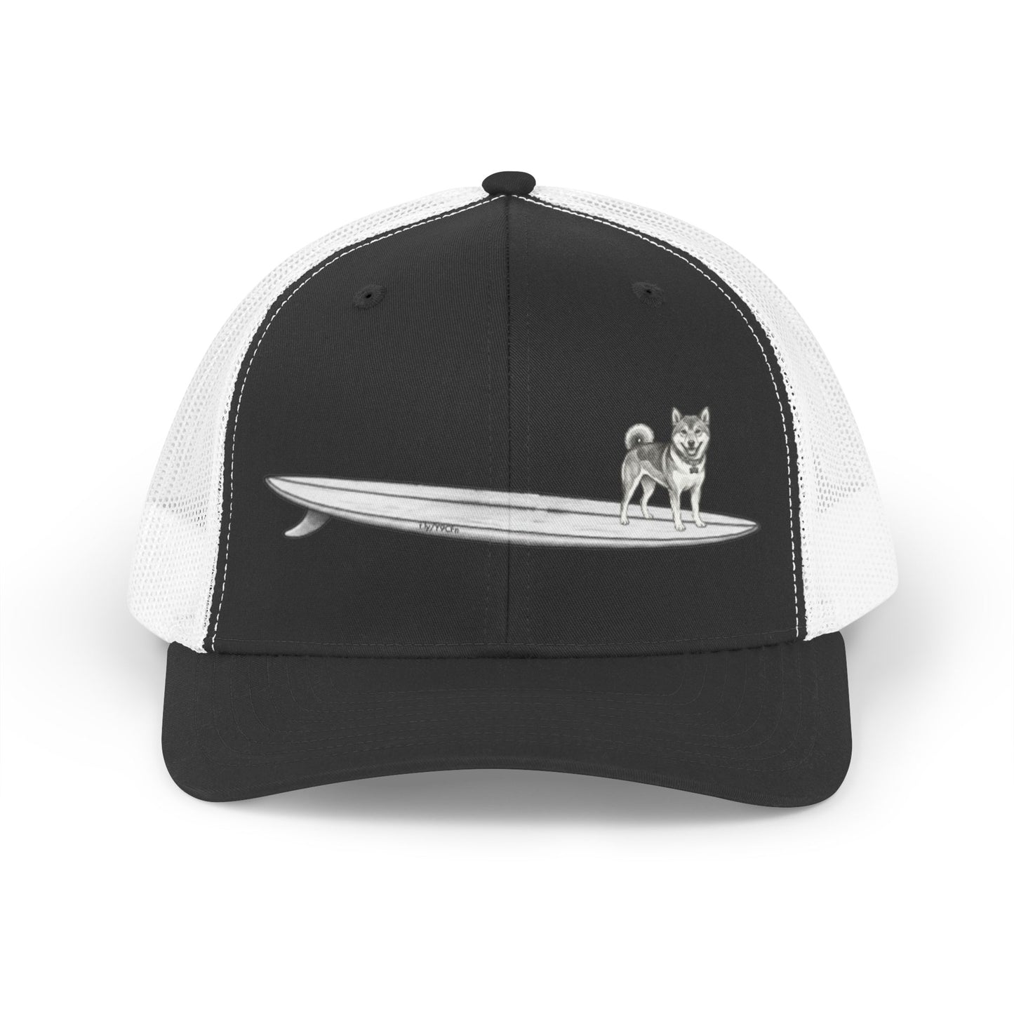 Black and white mesh trucker hat with a graphic of a Shiba Inu dog hanging twenty on a long  surfboard design on a black background