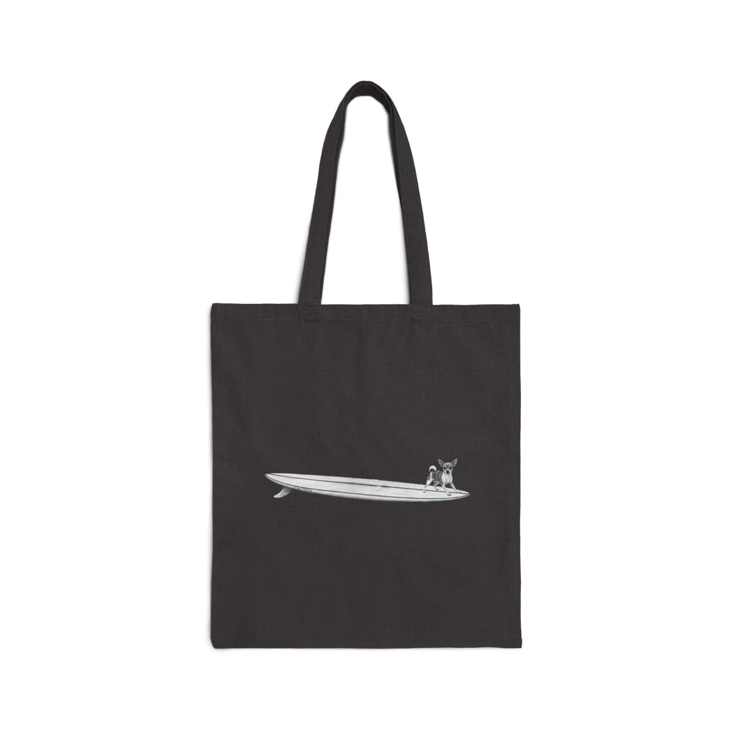 Black tote bag with a graphic of a chihuahua on a surfboard on a black background