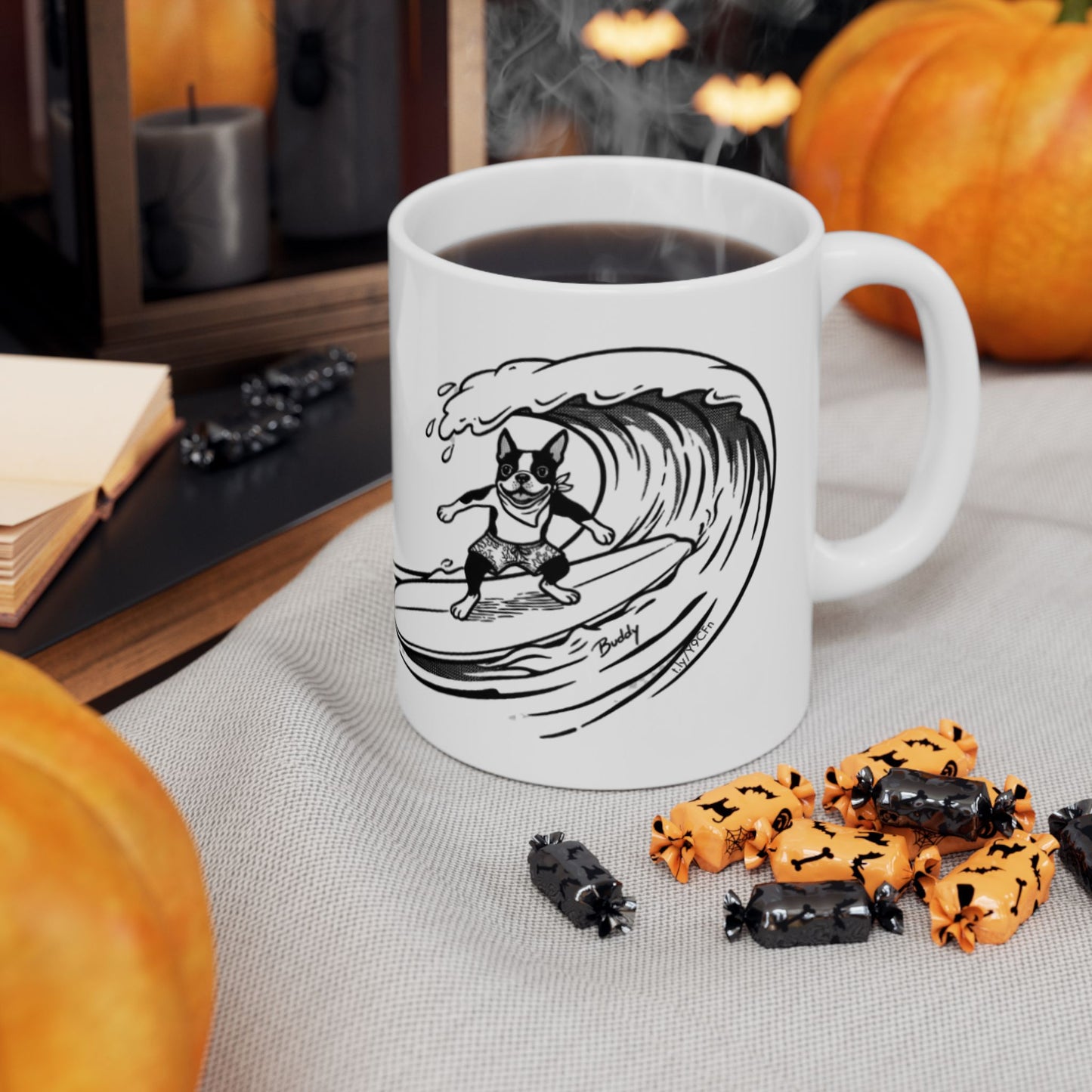 White mug with a black and white graphic of a Boston Terrier surfing on a big wave with a white background.
