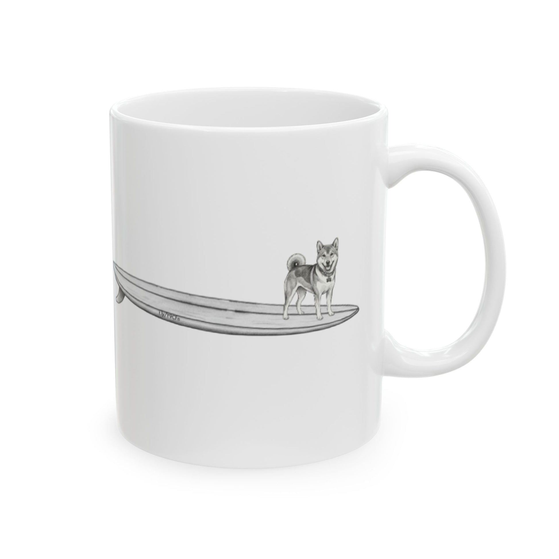 White mug with a design of a Shiba Inu dog hanging twenty on a long surfboard on a white background