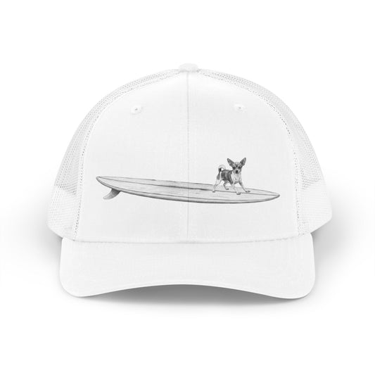 White hat with a design of a  Chihuahua on a longboard on a white backgroud.